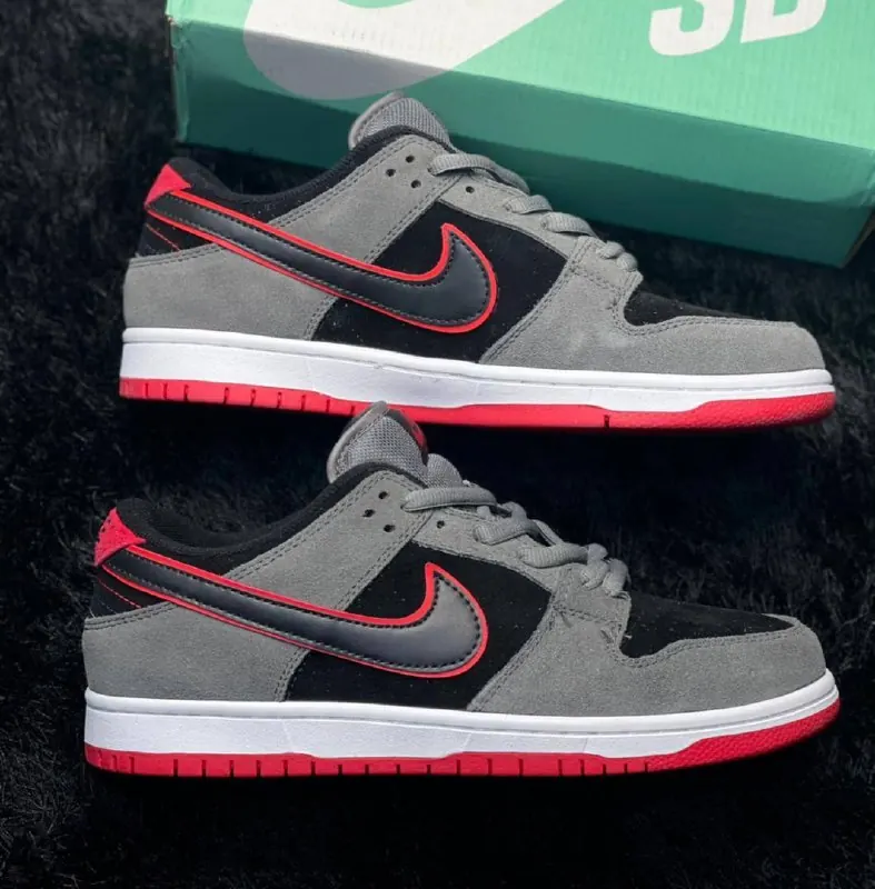 Grey and red low-top sneakers
